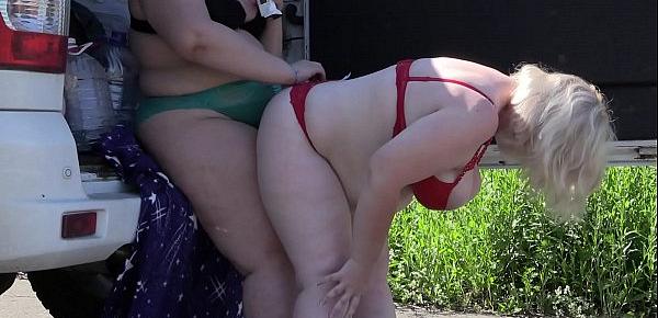  Voyeur spying on two fat lesbians who make a sex film near the car. Mature girlfriends with big asses behind the scenes. Fetish outdoors.